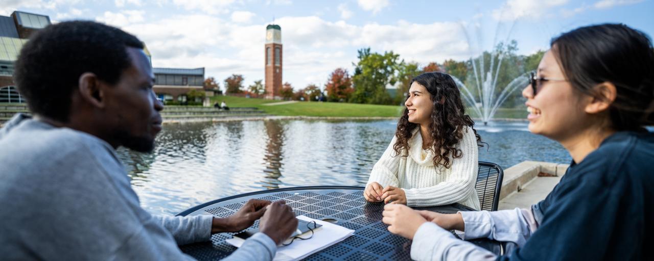 International students sitting together on campus